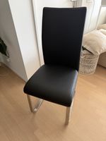 4x schwarze Freischwinger Esszimmerstühle – Edelstahloptik