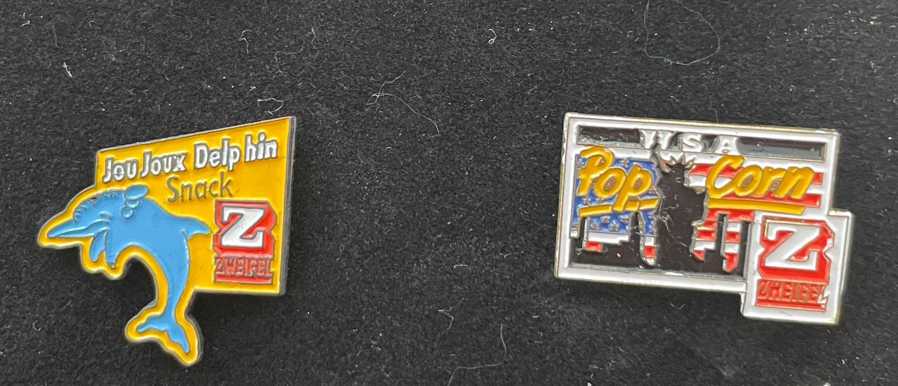 Placchette & Badge: 2 Pins von Zweifel - 90er – Nuovo e nell'imballaggio originale da Zell ZH venduto da johsu79