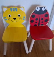 Zwei Spielba Kinderstühle aus Massivholz – Katze & Marienkäf