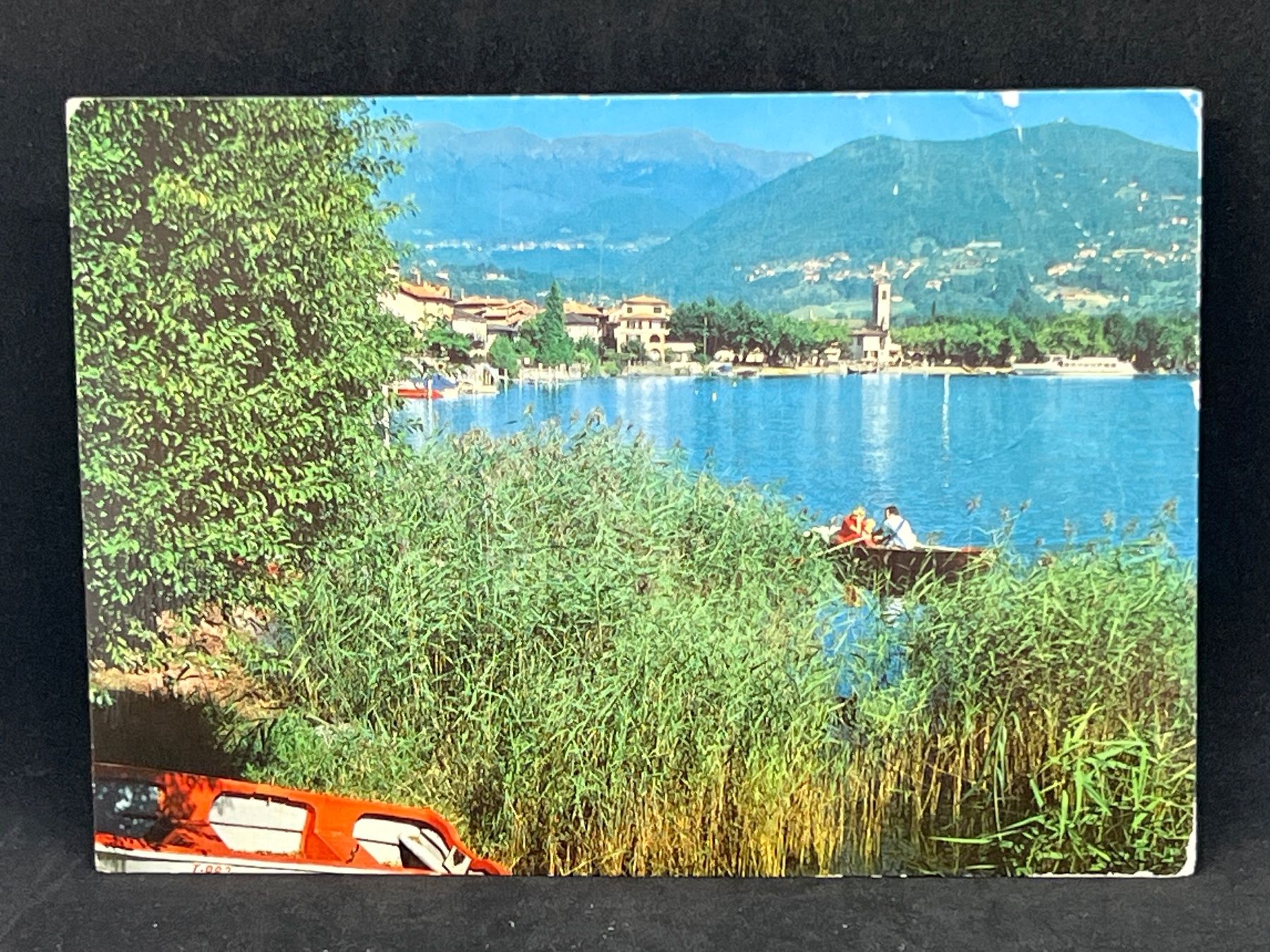 Cartoline postali: Caslano, Lago di Lugano – Usato da Widnau venduto da Brusi9