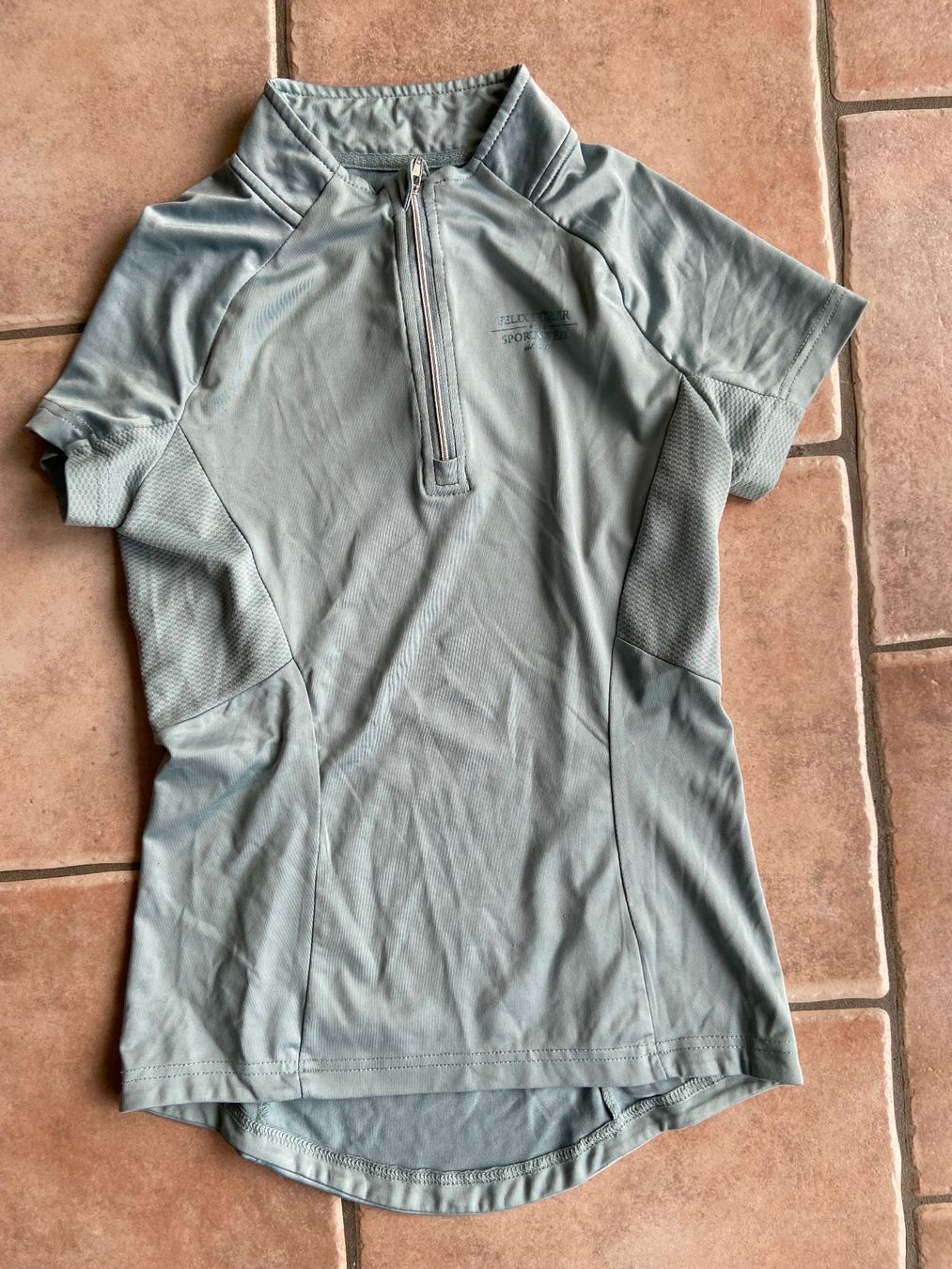 Felix Bühler T-shirt: Felix Bühler,  ZIP Reitfunktionsshirt mint – Usato da Wettswil venduto da alaskabaer
