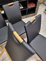 Chaises de salle à manger en similicuir noir. Articles neufs