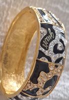 Superbe bracelet Guess noir/doré, strass - comme neuf!