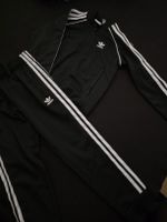 Adidas Trainingsanzug schwarz Grösse 128 guter Zustand