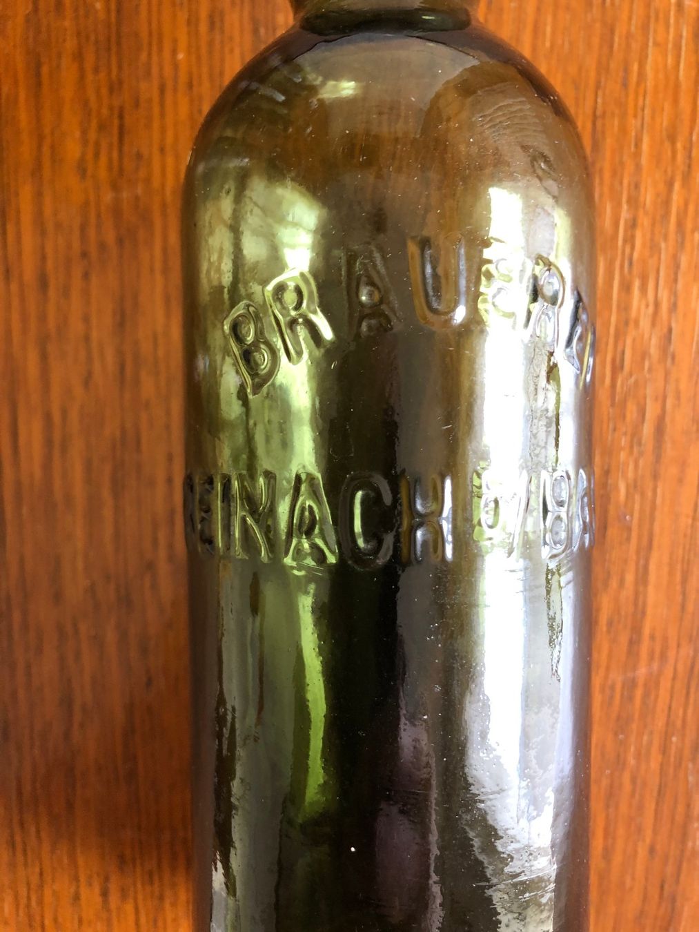 Bottiglie: BRAUEREI REINACH b/ BASEL Glasrelief – Usato da Ettingen venduto da glaed 1