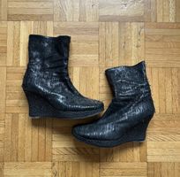 Black wedge boots
