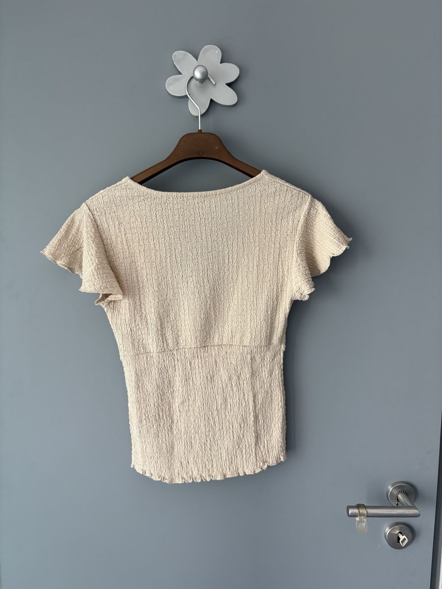 Top: Haut New Yorker beige taille S – Usato da Champlan venduto da mat_qff9 2
