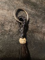 Schlüsselanhäng. aus Pferdehaar/Porte-clés en crin de cheval