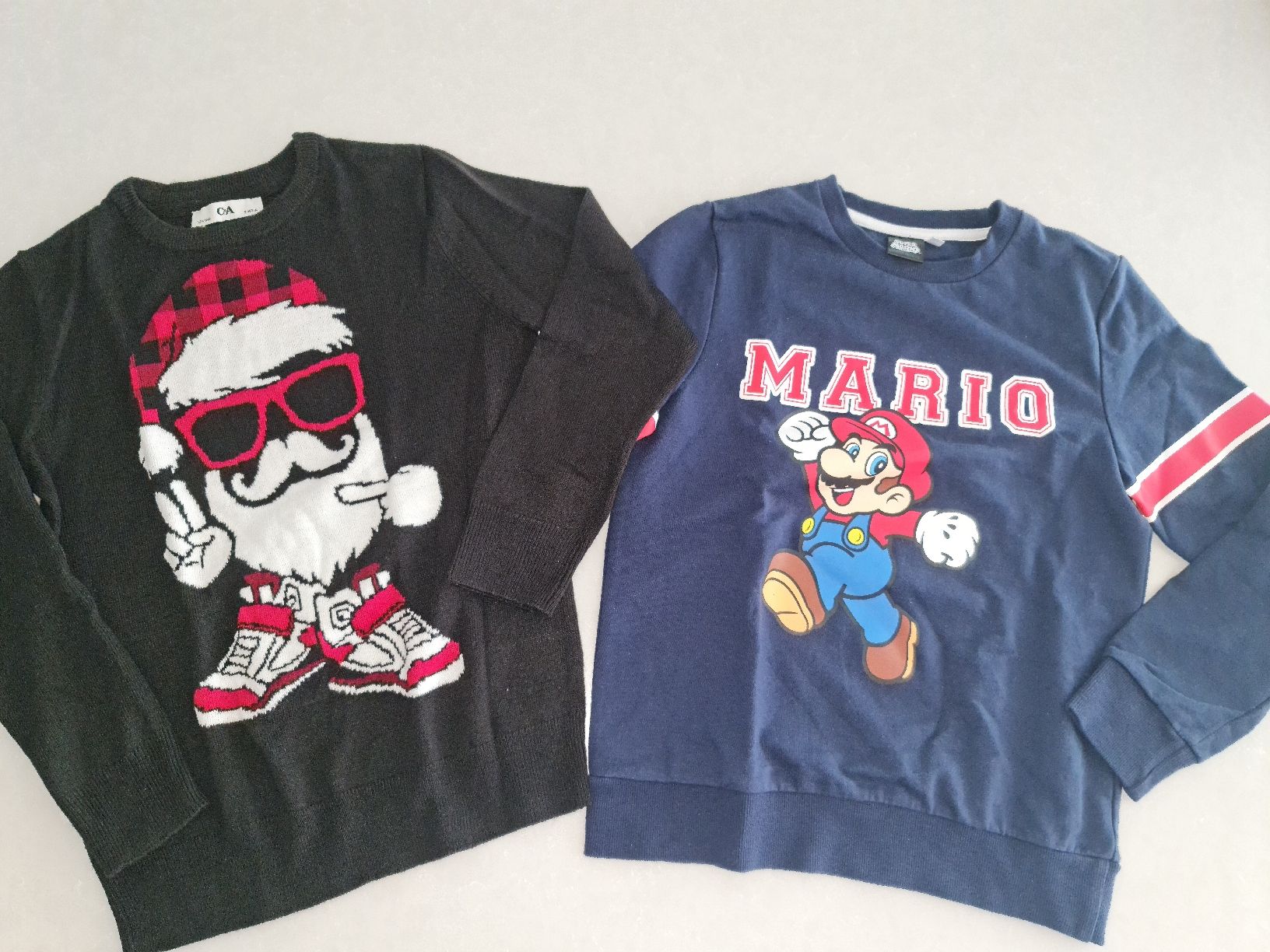 Maglioni & Felpe: 2 Pullover Mario & Weihnachtsmann Gr. 134/140 – Usato da Bülach venduto da Rommar