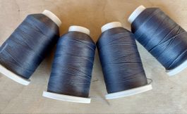 Overlock Faden 4 Spulen Pauschgarn grau