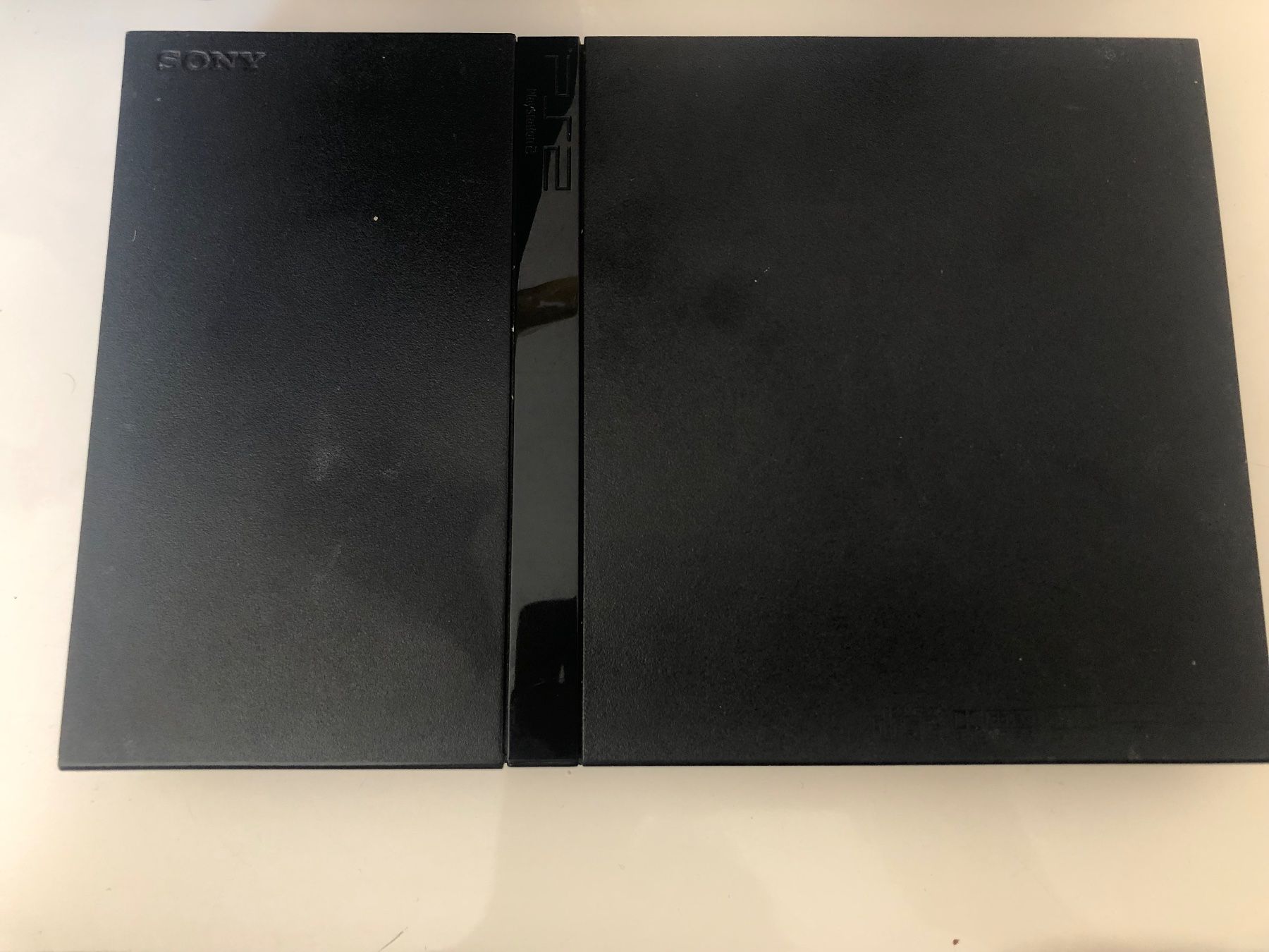 Sony Console: PS2 slim avec jeux/ 2 manettes – Usato da Cugy VD venduto da oth_7btj