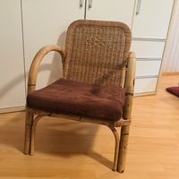 Rattan Sessel mit braunem Sitzkissen 