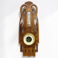 Ancien baromètre anéroïde suisse Art déco en bois sculpté