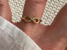 Bague ∞ infinity en acier inox doré avec zircons