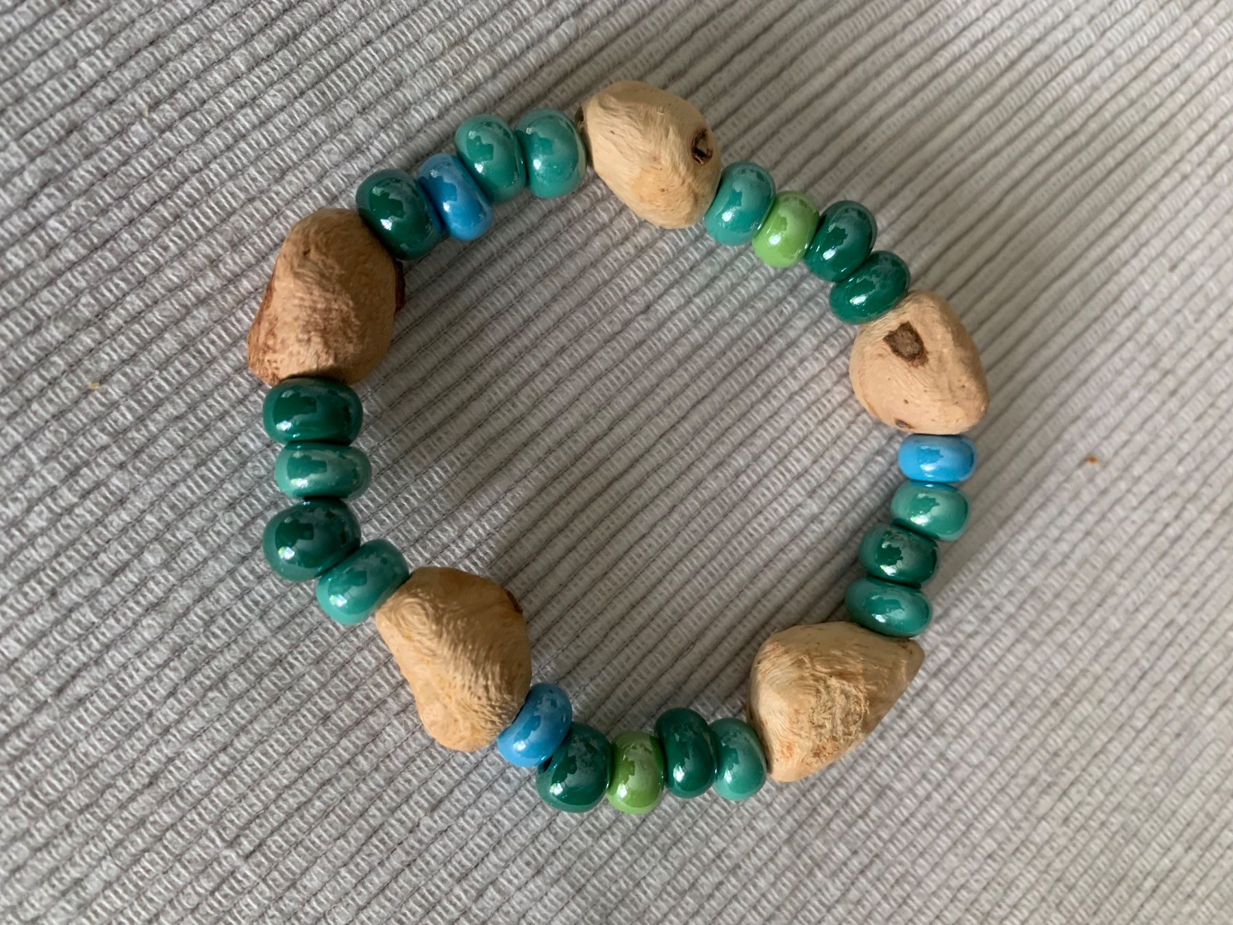 Bracelets: Armkette mit einer Baumperle – Neuf avec emballage d'origine à Rudolfstetten par medium02