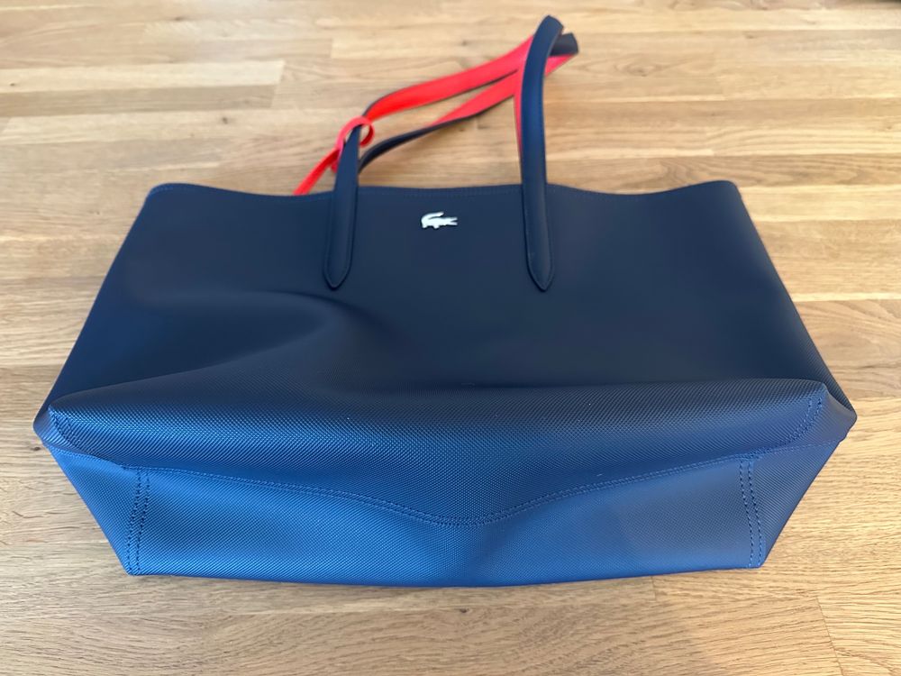 Sac lacoste reversible outlet bleu et rouge