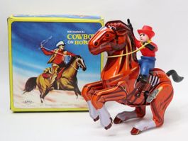 MTU Blech Pferd mit Cowboy zum aufziehen Blechpferd