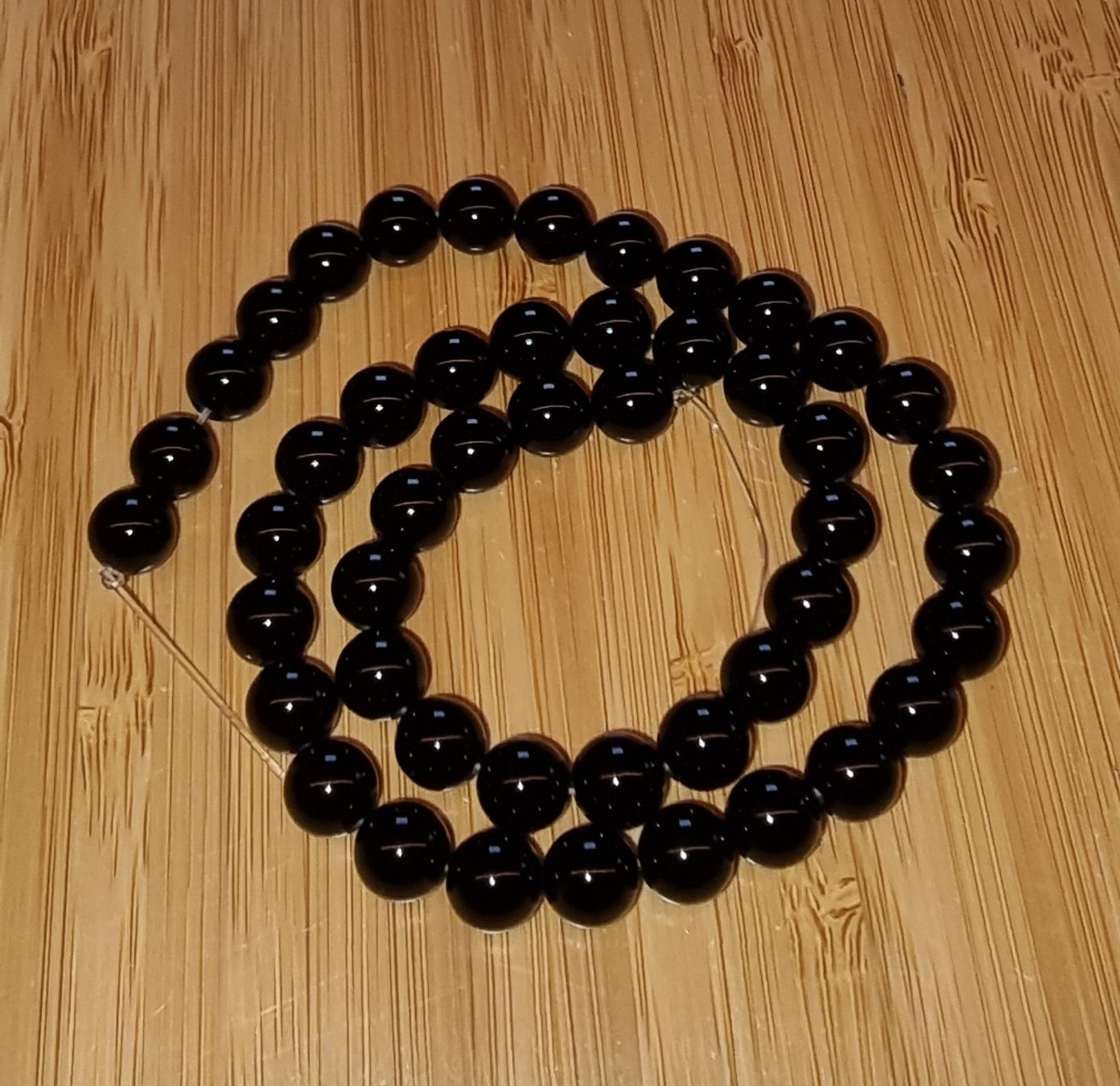 Minerali & Pietre curative: Onyx schwarz 8mm. Strang – Nuovo e nell'imballaggio originale da Menziken venduto da Mirager 1