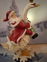 NIKOLAUS MIT LICHT REITET AUF ENTE