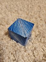 Faltbarer Puzzle-Würfel in gebrauchtem Zustand