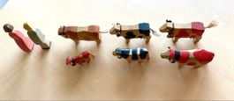 Holzfiguren Kühe und Menschen Konvolut 7-teilig