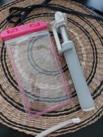 Smartphone travel kit : a selfie stick and a water bag