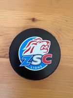 Eishockey Puck ZSC Lions schwarz Kunststoff guter Zustand