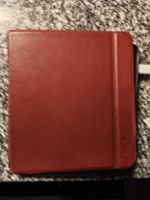 E-Reader Tolino schwarz mit roter Schutzhülle