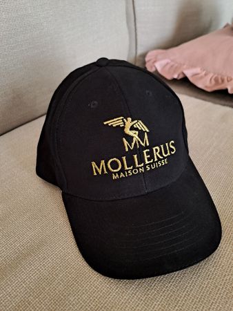 Kappe Mollerus Maison Suisse schwarz gold Neu