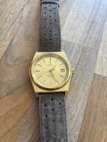 Montre Tissot Seastar Quartz dorée bracelet cuir usé