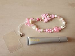 1 Rhode Peptide Lip Tint und 1 Handy Anhängerkette