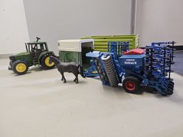 Bruder: John Deere Traktor mit Anhänger u. Lemken Sämaschine