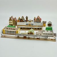 Lot de 11 bâtiments miniatures pour circuits de train