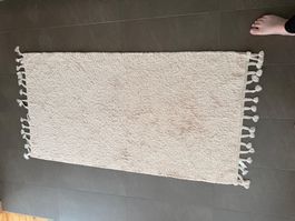 Tapis de bain beige avec franges bon état