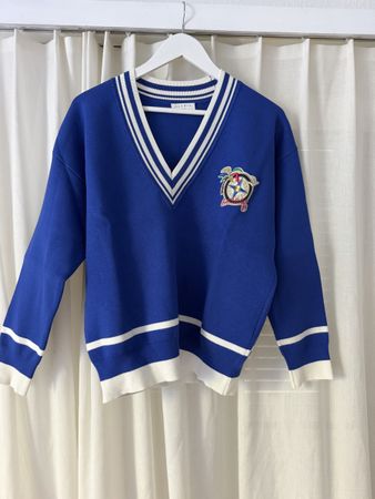 Sandro Strickpullover blau mit Aufnäher