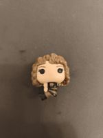 Figura Funko Pop piccola capelli ricci castani 