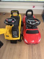 Ride-on toys: Red Mercedes and yellow CAT excavator
