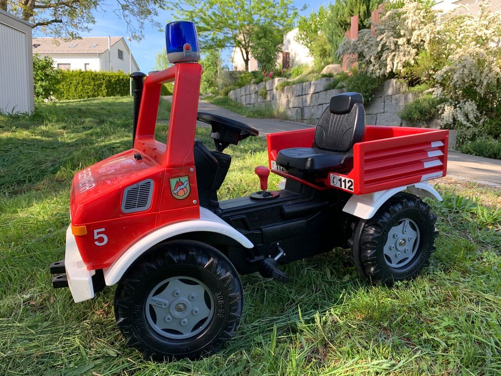 Rolly Toys Fire Unimog 038275 - Camión de Bomberos edición 2020 con Remolque (Coche a Pedales de 3 a 8 años, jeringuilla, Intermitente, Cambio de Marchas, Freno