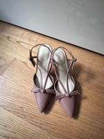 Nude bow slingback heels