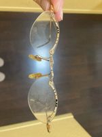 rahmenlose, goldene brille