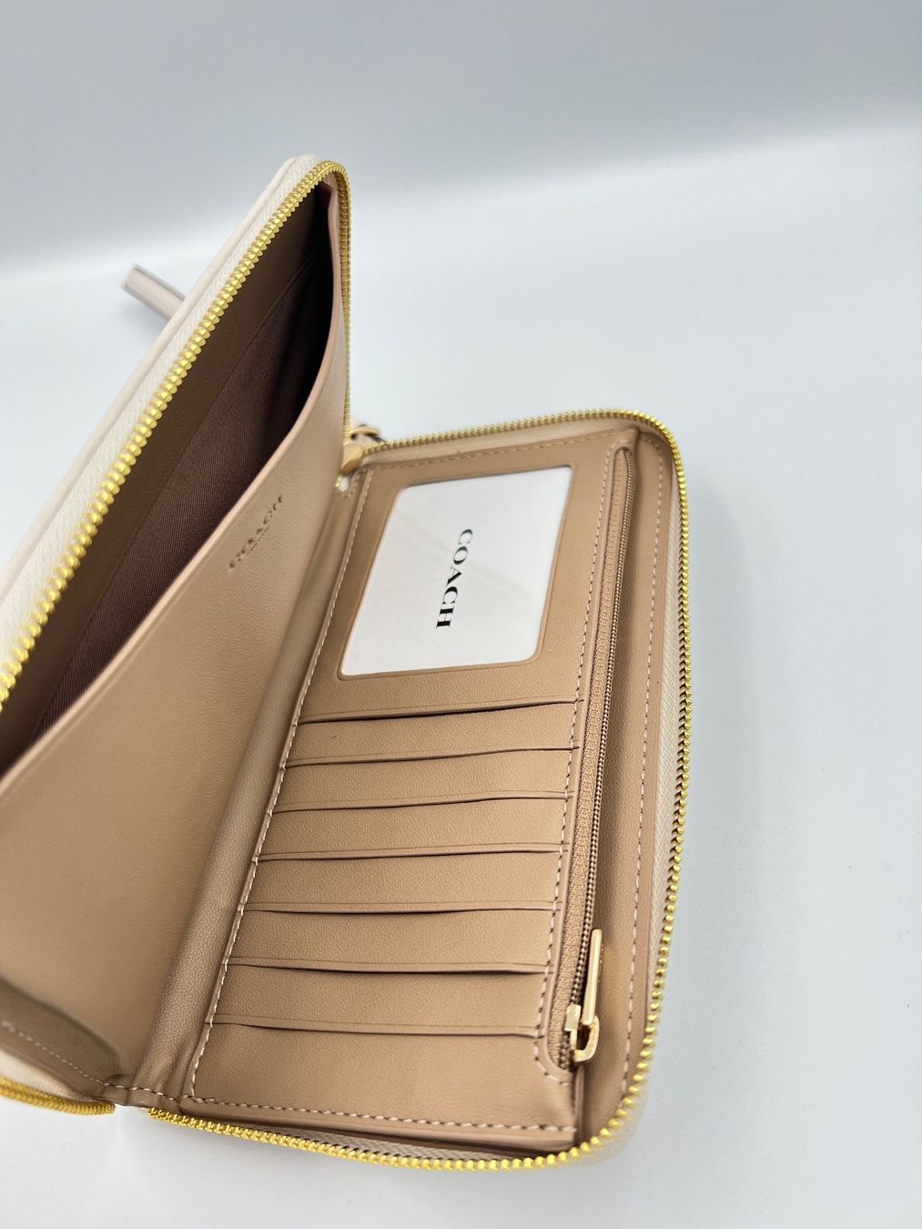 Coach Portamonete: Coach Dempsey large phone wallet weiss/beige – Nuovo e nell'imballaggio originale da Wiedlisbach venduto da Sistershop 5