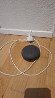 Google Nest Mini charcoal smart speaker with charger