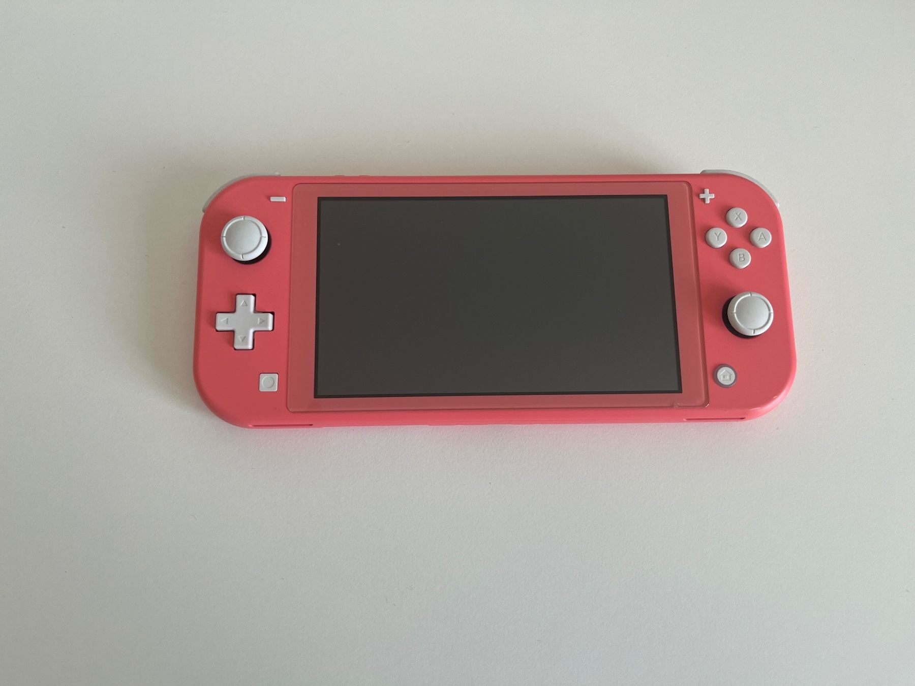 Nintendo Konsolen: Nintendo Switch Lite Koralle – Gebraucht aus Olten von rahelaurora