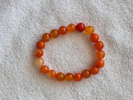 Perlenarmband aus Karneol orange rund elastisch neu
