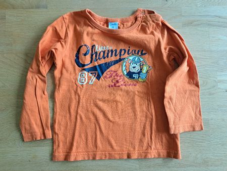 Oranges Langarmshirt mit Champion Druck, Grösse 98 Smile