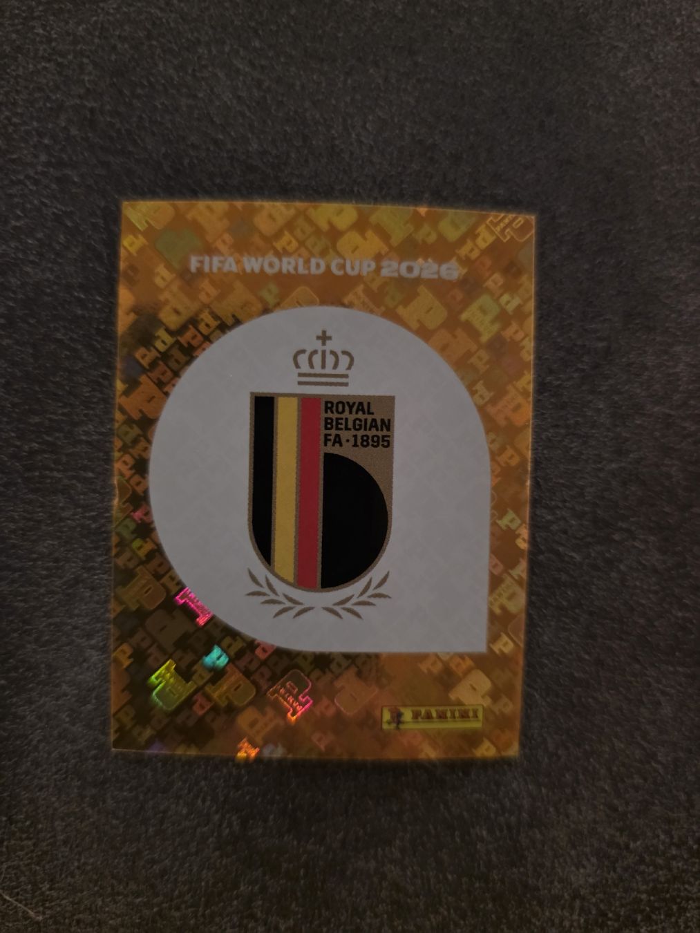 Panini Cartes à collectionner: Panini WM 2026 BEL 1 Wappen – Neuf (Voir description) à Romanshorn par leeh78