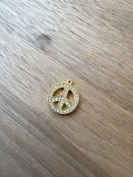 Peace sign pendant gold colored with stones