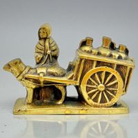 Ancienne statuette en bronze laitière avec charrette à chien