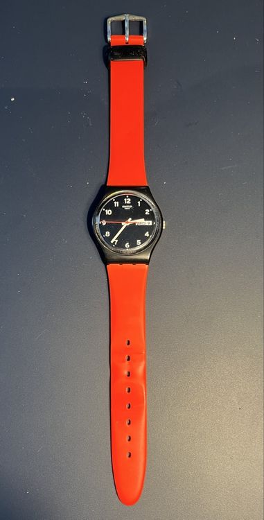 Swatch Uhren: Klassische Swatch Uhr mit orangen Armband – Gebraucht aus Lupsingen von sil_l6wg