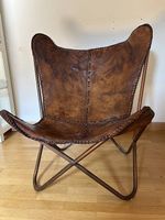Fauteuil "papillon" vintage en cuir marron